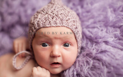 Newborn on wool rug.